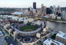 All 30 MLB Ballparks Ranked From Worst to Best Aerial view of Pittsburgh with the U.S. Steel skyline, the Allegheny River, and PNC Park in the foreground beneath a cloudy sky.